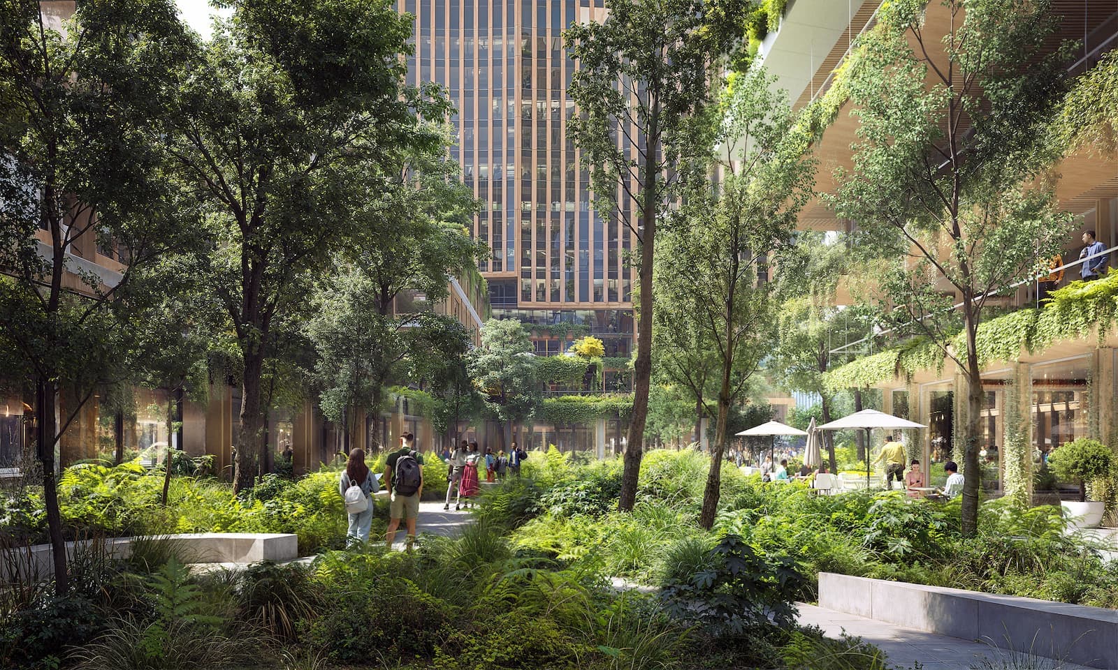Panorama van Amsterdam Zuidas met kantoren, spoorlijnen en nieuwe ontwikkeling.